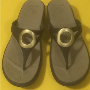 Crocs size 10. Brown with gold detail.